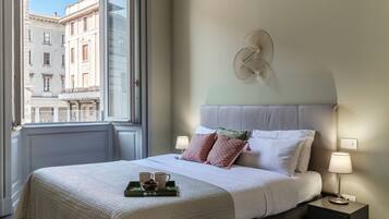 Appartement | Literie de qualité, couette en duvet, fer et planche à repasser