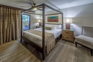 Cozy retreat with a four-poster bed, nightstand, and comfortable chair.