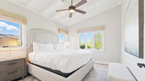 A bedroom with a large bed, a ceiling fan, and two windows with blinds. - Afton Mountain Vineyards (Afton)