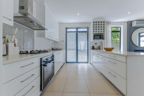 Fridge, microwave, oven, stovetop - Three Bedroom Family Haven  Sea Point (Cape Town)