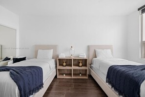 2 bedrooms, desk, iron/ironing board, travel crib