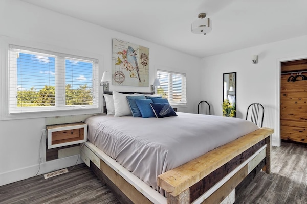 Simplicity Meets Comfort: Enter the tranquil haven of our first bedroom, where the focal point is a spacious king-sized bed that promises nights of restful slumber. The inviting ambiance and understated elegance make this room the perfect retreat