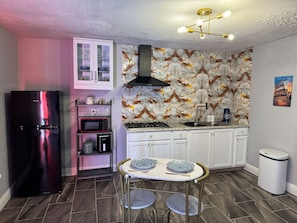 Fridge, microwave, stovetop, coffee/tea maker
