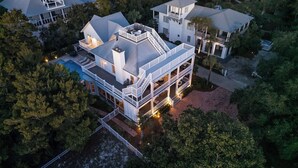 A large, multi-story house with a prominent balcony and a swimming pool. - Southern Breeze | Easy Beach Access & Private Pool (Inlet Beach)