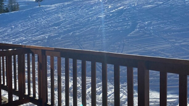A snow-covered ski slope with a wooden fence in the foreground. - Studio with balcony in Plagne Village (Plagne Village)