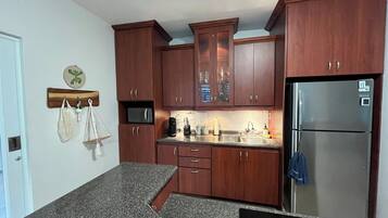 Fridge, microwave, stovetop, coffee/tea maker