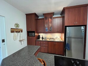 Fridge, microwave, stovetop, coffee/tea maker