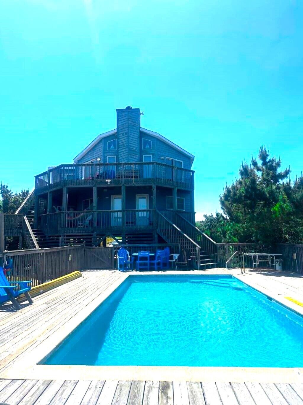 A large building with a pool in front.