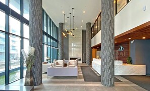 Relax in our spacious lobby, featuring a comfortable seating area and stunning views through large windows.