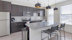 Fridge, dining tables - Landing | Spectacular 1BD, Pool, Yoga Studio (Fort Worth)