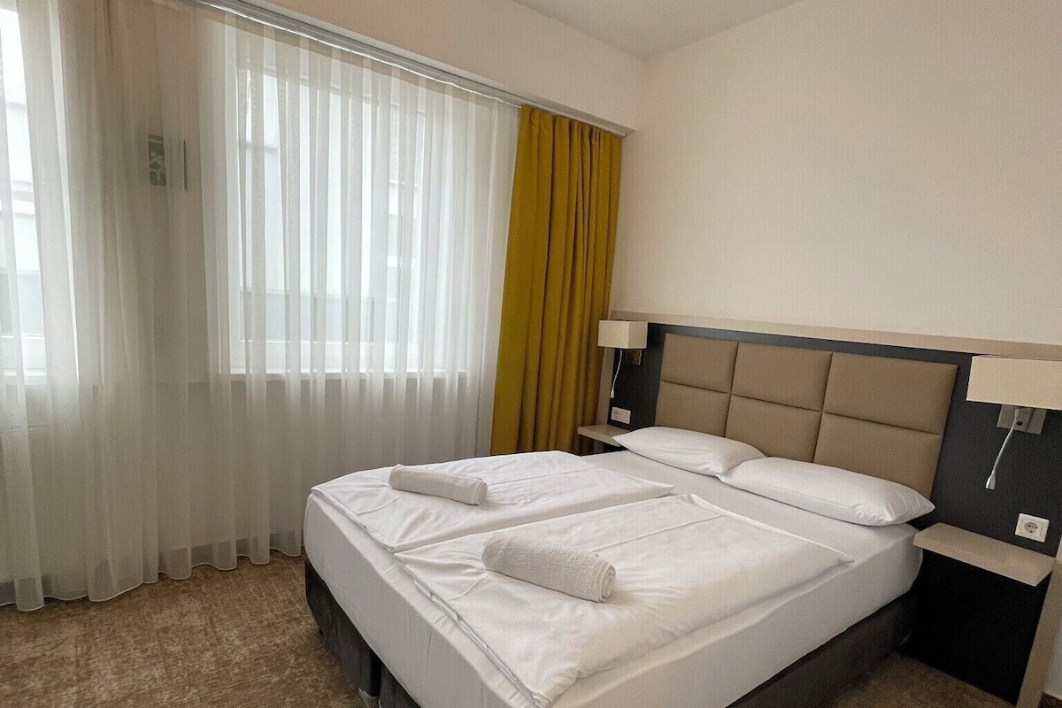 Desk, laptop workspace, free WiFi, bed sheets