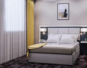 A modern hotel room with a large bed, bedside tables, a nightstand, a lamp, and a framed picture on the wall. - THE PLACE HOTEL - Frankfurt City Messe (Frankfurt)