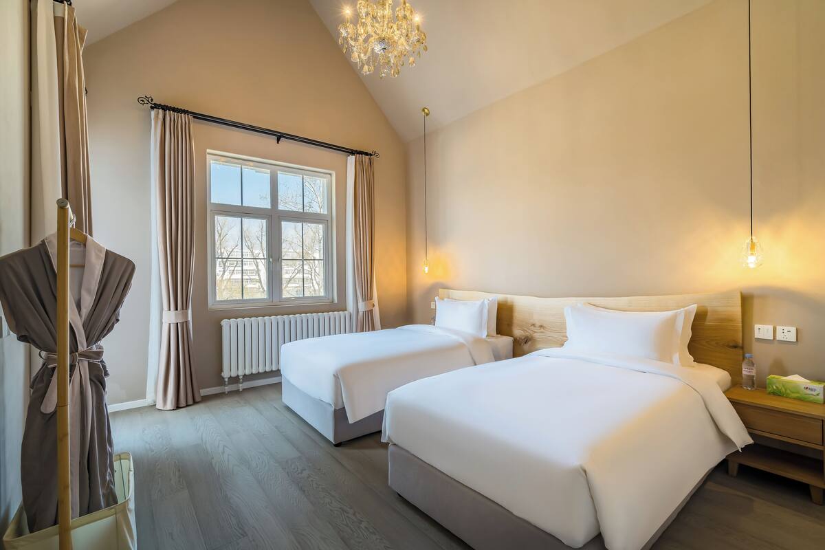 2 habitaciones, ropa de cama de alta calidad, edredón y minibar