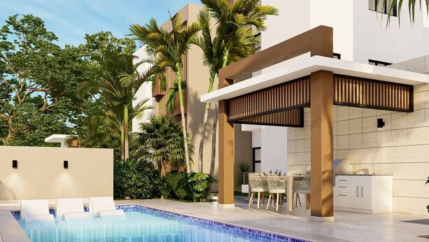 Un espace piscine extérieur moderne, doté d’une piscine carrelée, d’un espace détente couvert et d’un meuble blanc.