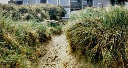 Oceanfront condo with king suite, balconies, & pet-friendly comfort—steps from the sand!