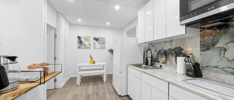 Fridge, microwave, stovetop, coffee/tea maker