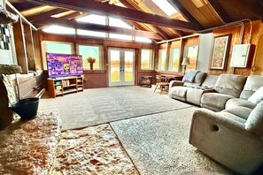 TV, fireplace, books - Waterfront Rock Shower Suite w/ Sunset View Room! (Saint Joseph)