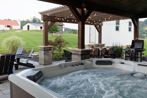 Scenic farm escape w/ resort style patio, hot tub and designer kitchen!
