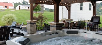 Scenic farm escape w/ resort style patio, hot tub and designer kitchen!