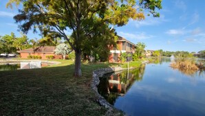 A tranquil lakeside scene with a house and a small dock extending into the water. - Literally 3 mins from Siesta with its number 1 beaches!!!!
Location! Location! (Sarasota)