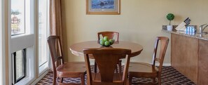 Enjoy meals in this cozy dining area with a round table and four matching chairs.