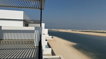 Beach Front 4-bedroom villa with heated SPA pool