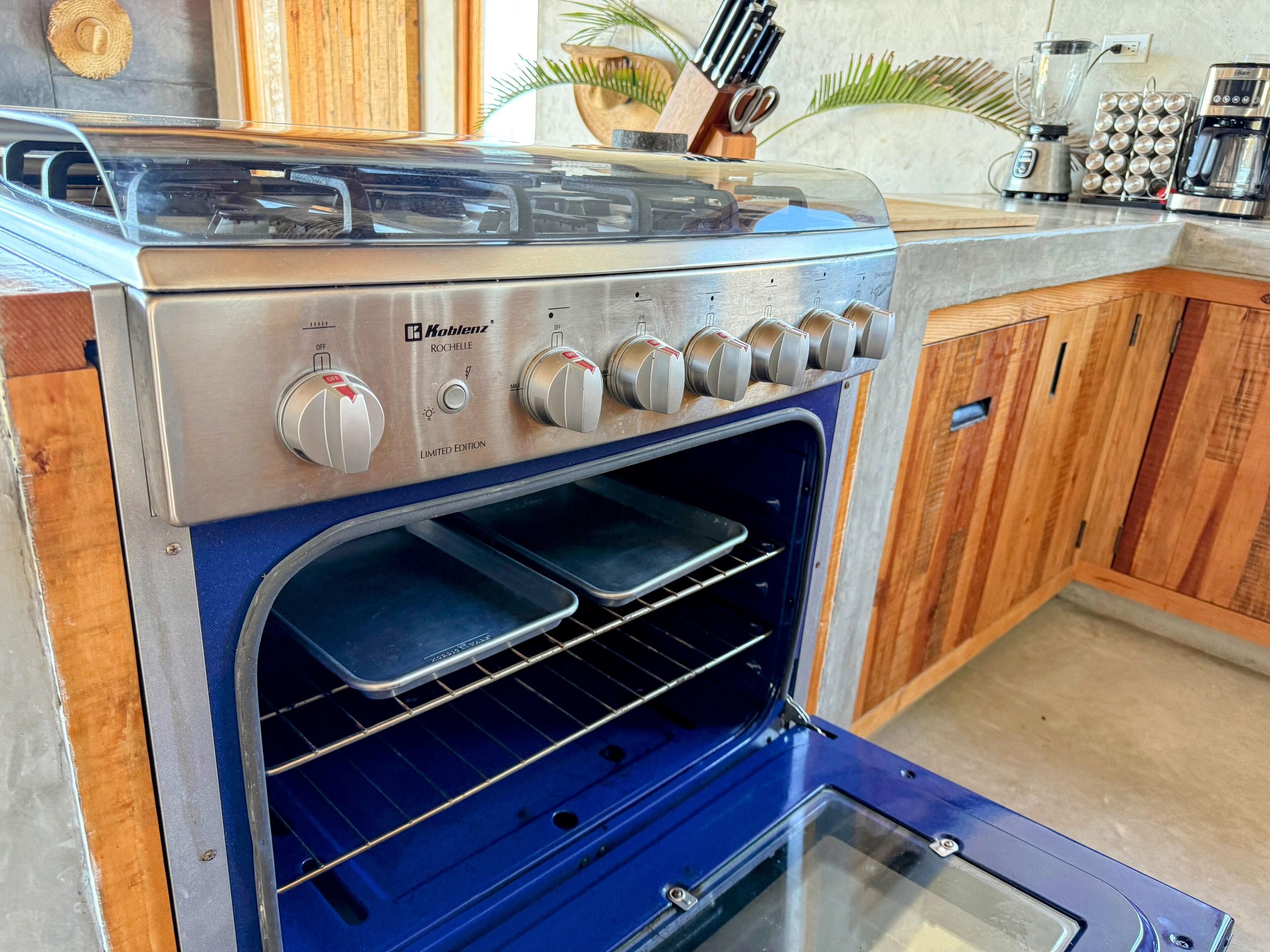 A kitchen with a built-in oven and a stovetop.