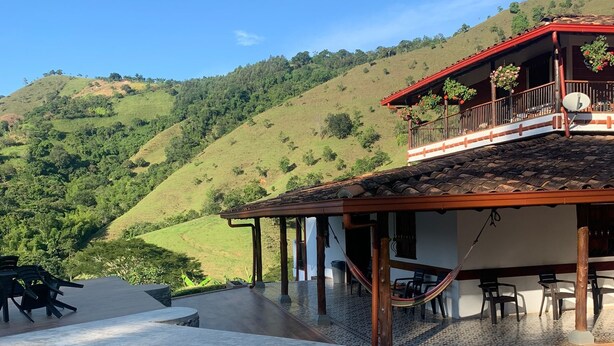 A pool area with a hot tub, outdoor seating, and a view of a hillside. - VILLA CATALINA FARM WITH SWIMMING POOL AND JACUZZI NEAR LA PINTADA  (Santa Bárbara)
