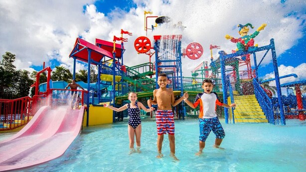 A water park with multiple slides and play structures.