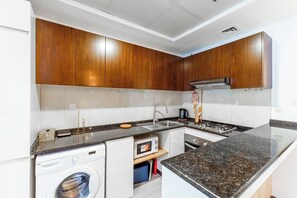 Fridge, microwave, oven, stovetop - Spacious Studio in JVC | Cozy Living with Gym & Serene Community | Managed by Think Realty (Dubai)