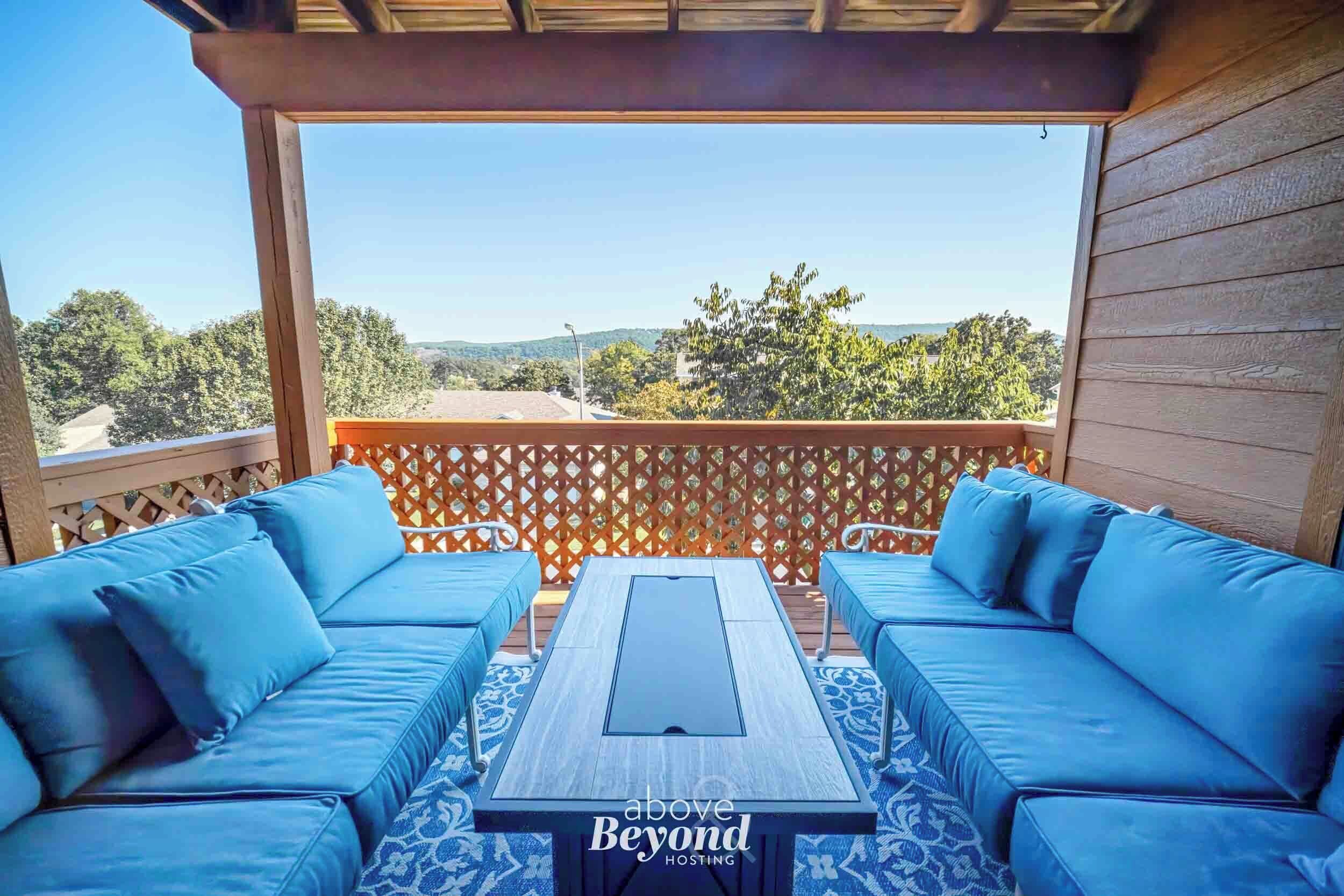 Private balcony with cushioned outdoor seating and peaceful Branson views, perfect for morning coffee or evening relaxation