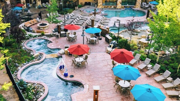 A resort with multiple hot tubs, outdoor seating areas, and a pool. - Spring Break in Breckenridge! Ski in/out on Peak 7 (Breckenridge)