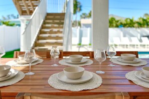 Outdoor dining - Grace by The Sea · 2025 Build · Steps to Beach (Fort Myers Beach)