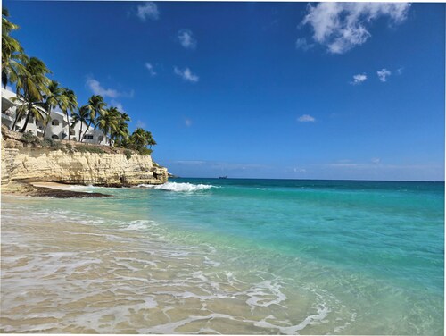 Beachfront condo at beautiful Cupecoy Beach Club.  2 bedroom, 3 bath, amenities!