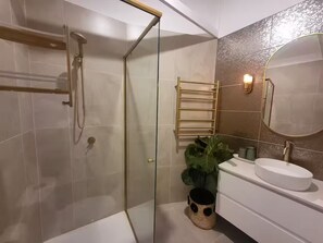 Shower, hair dryer, towels, soap