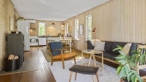 A cozy, open-plan living space with a kitchen, dining area, and seating area. - Cozy home in Vejby with WiFi (Vejby)