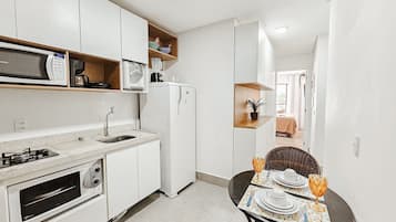 Fridge, microwave, oven, cookware/dishes/utensils