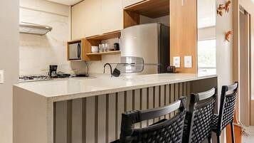 Fridge, microwave, cookware/dishes/utensils