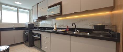 Fridge, microwave, cookware/dishes/utensils