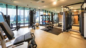 A modern gym with various exercise equipment, large windows, and a clean, well-lit interior. - Adelaide Central 1BR APT Overlooking Rundle Mall (Adelaide)