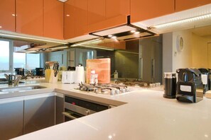 Fridge, microwave, oven, stovetop - Amyra Residences on Rowlands Place - Unit 1607 (Adelaide)