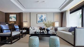 Deluxe Villa, Garden View | Living room | Flat-screen TV