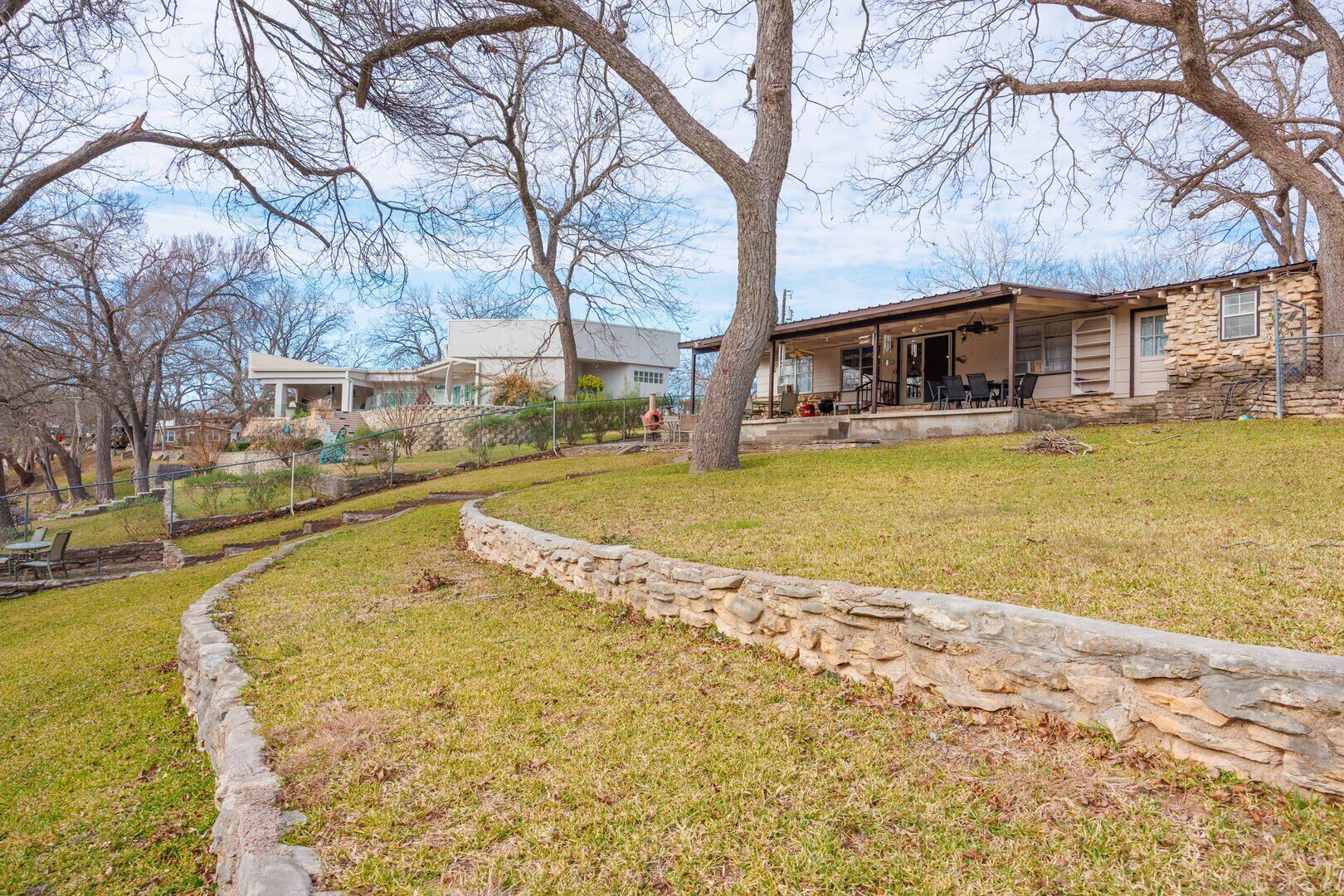 Terraced backyard + multiple patios at Hooked on the River