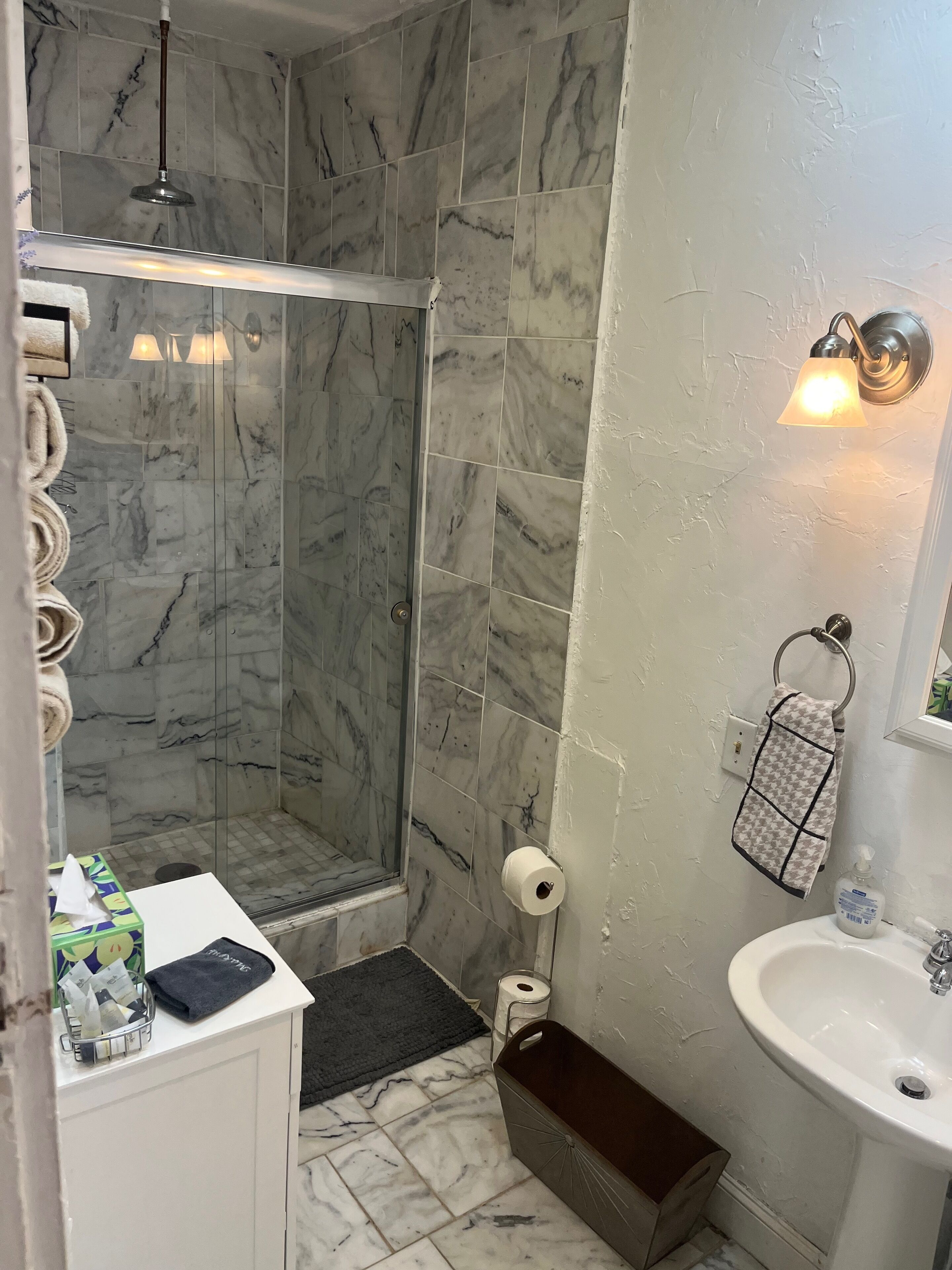 Shower, hair dryer, towels, soap