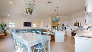 A spacious kitchen with white cabinetry, a central island, and modern appliances. - PP627 Private Heated Pool, Golf Cart Included, Parking for 6 (Port Aransas)