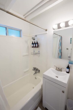Shower, hair dryer, towels, shampoo