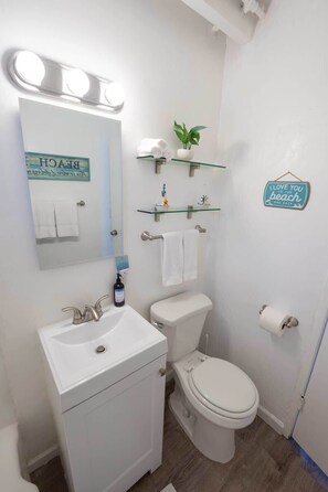 Shower, hair dryer, towels, shampoo