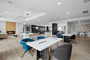 Relax in our spacious lobby with a cozy seating area, fireplace, and modern reception desk.