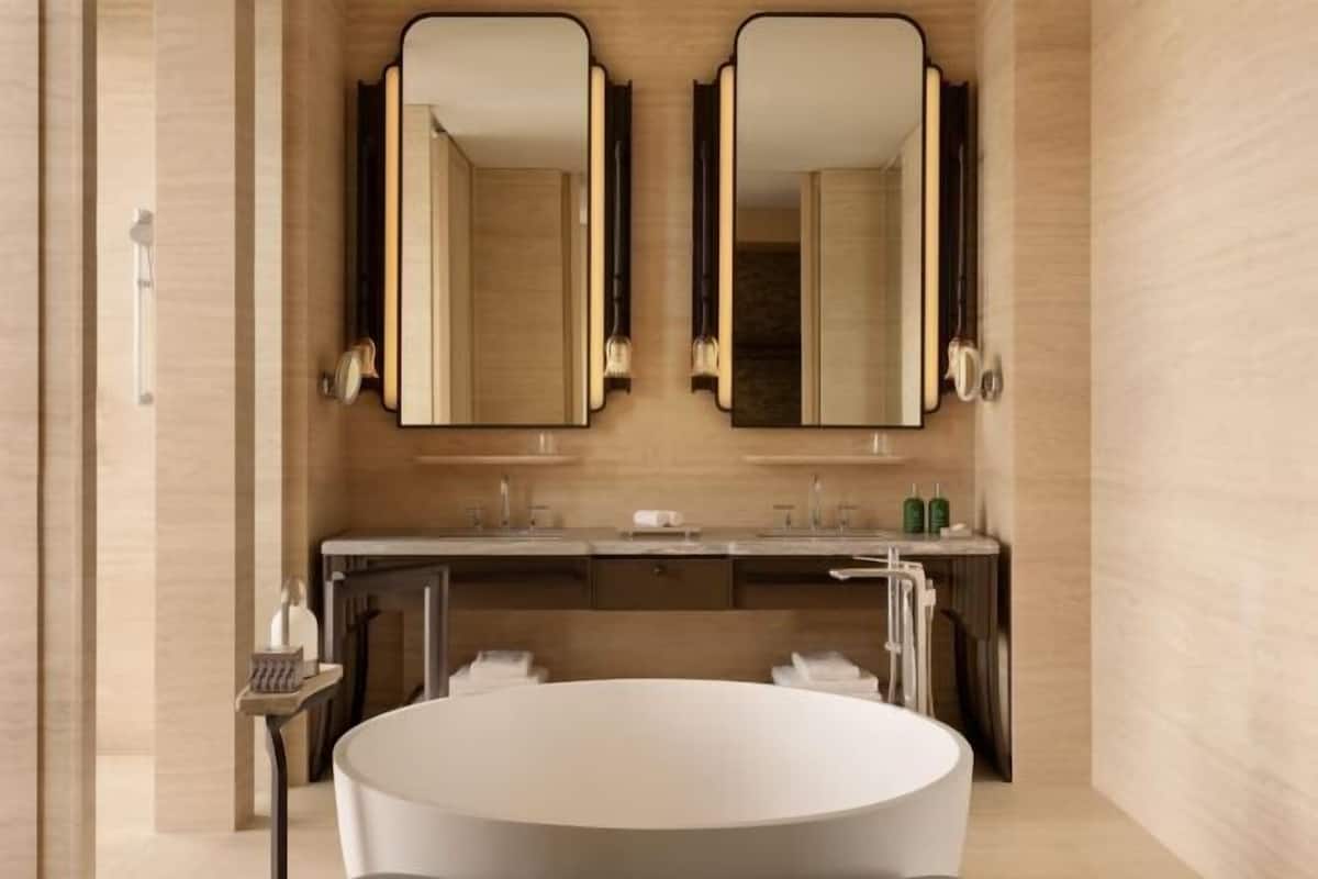 Separate bathtub and shower, rainfall showerhead, hair dryer, bathrobes