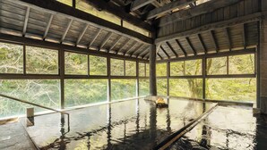 A large indoor swimming pool with a high ceiling and large windows. - Ooedo Onsen Monogatari Premium Sendai Sakunami (Sendai)